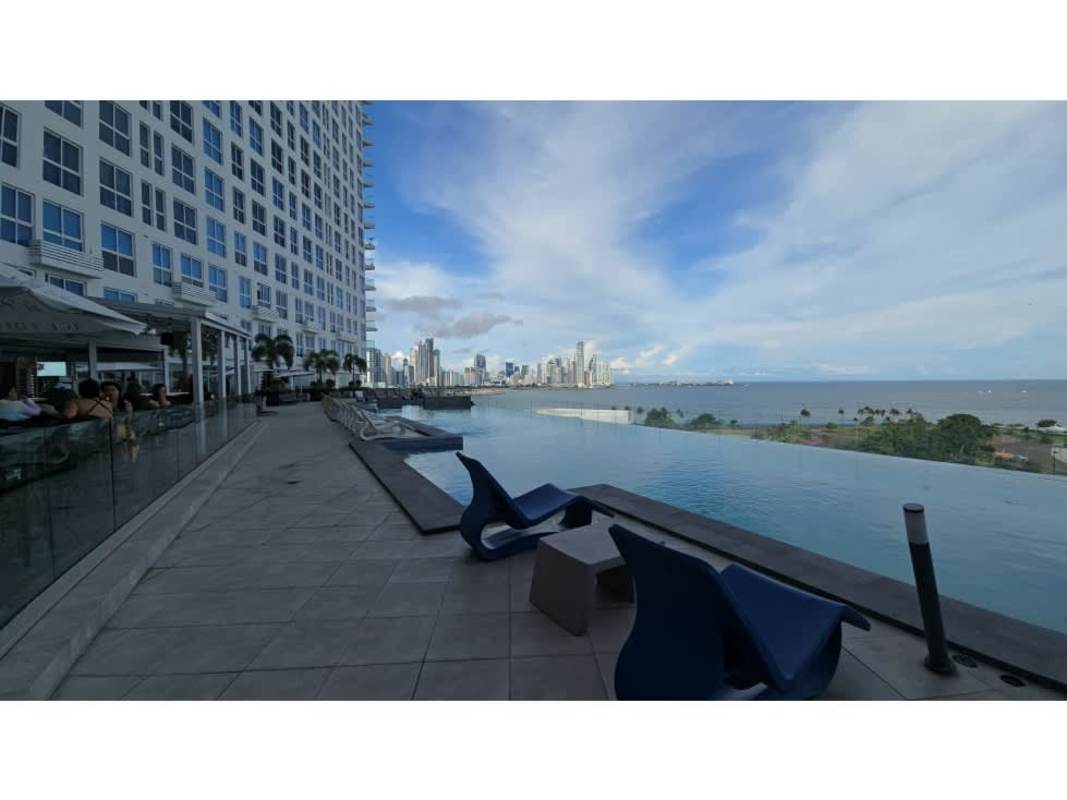 Minimalist kitchen with subway backsplash, gas cooktop, stainless appliances in The Sands condo Panama City