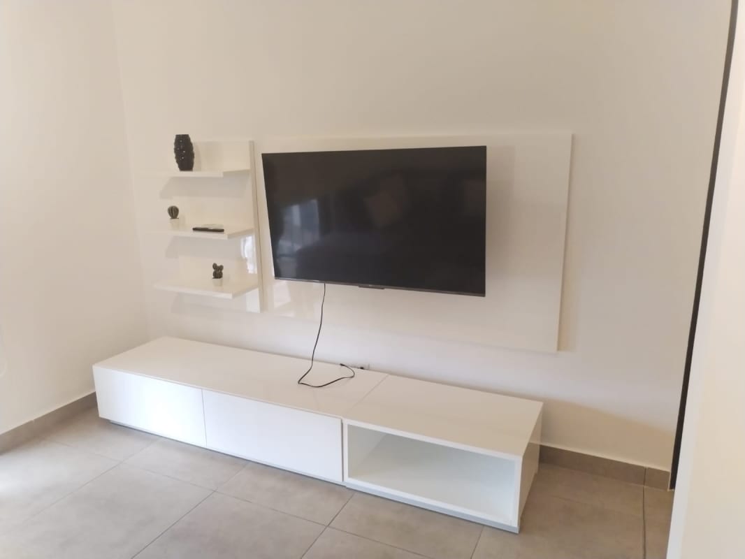 Modern kitchen with granite countertops, dark wood cabinets, stainless appliances at PH Embassy Village Panama