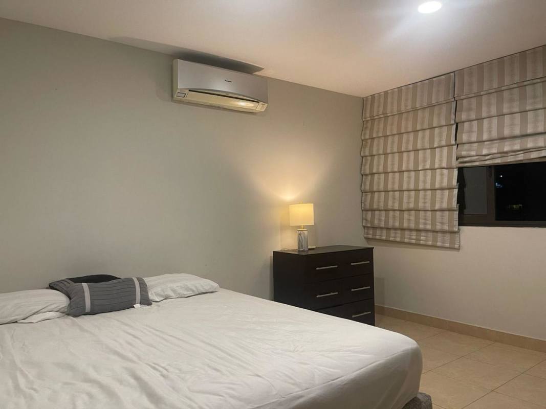 Refined dining area overlooking Pacific Ocean and city skyline in Costa del Este apartment