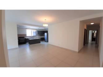 Open design kitchen with island in River Valley Panama Pacifico apartment