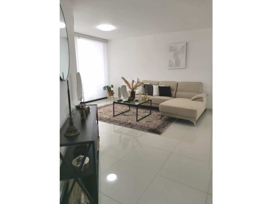 Kitchen with granite countertops, gas stove and wood cabinets at PH Carreras Tower El Cangrejo Panama