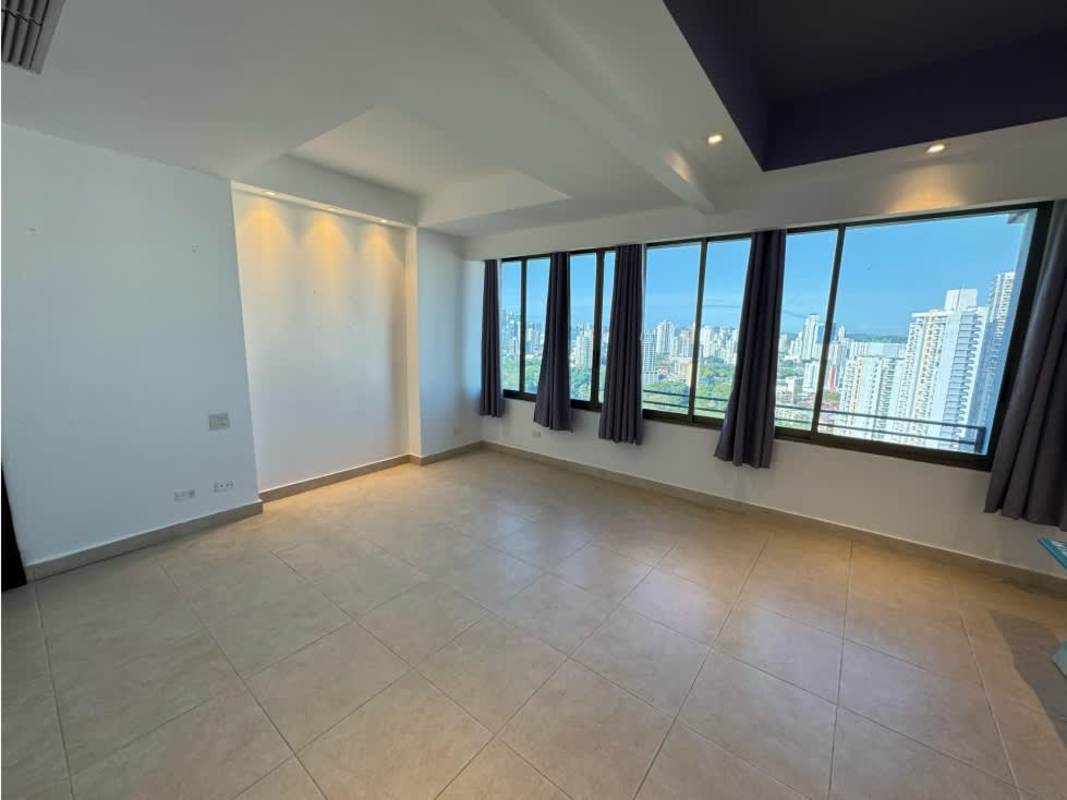 Dining area with panoramic windows, neutral tiles, city views at PH Golf Tower Panama