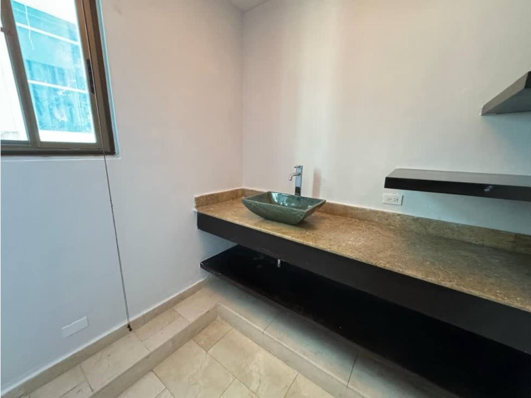 Master bathroom with double sinks, marble counters, panoramic windows at PH Golf Tower Panama City