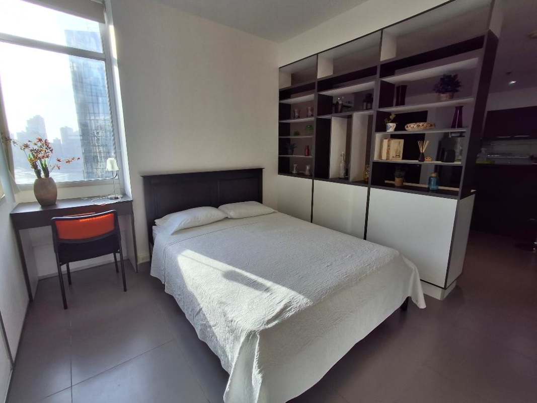 Compact laundry closet with stacked washer and dryer in PH Colores de Bella Vista Panama City