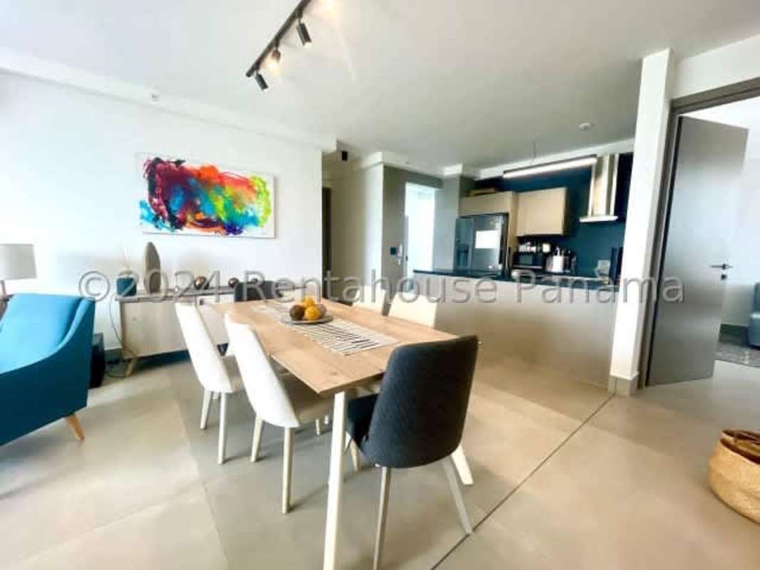 Master bedroom with expansive floor-to-ceiling window and ocean views at PH Victory Wellness