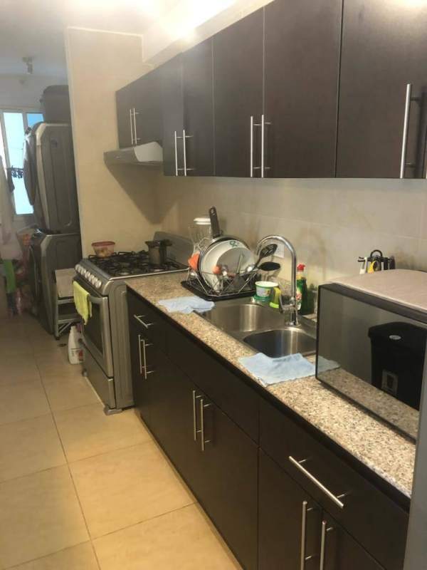 Bright living dining area with balcony park views in Carrasquilla San Francisco Panama