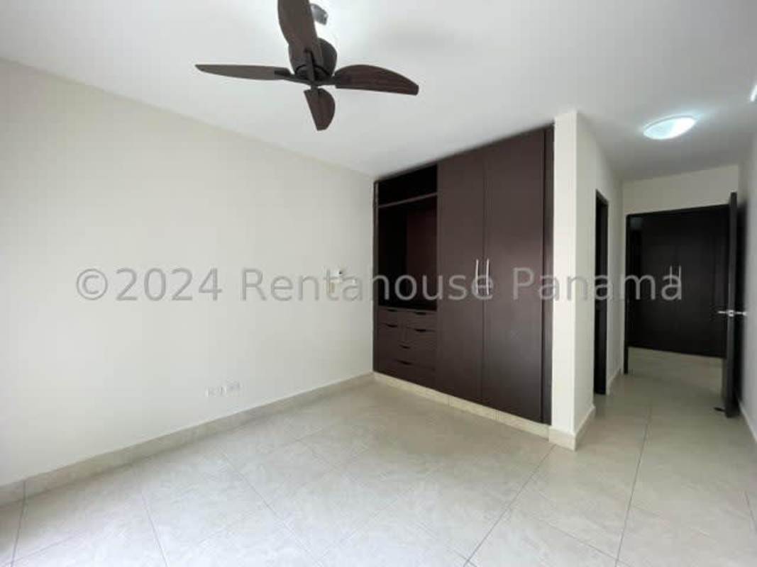 Bedroom features walk-in closet ensuite bath tile flooring PH Albrook Gardens Panama