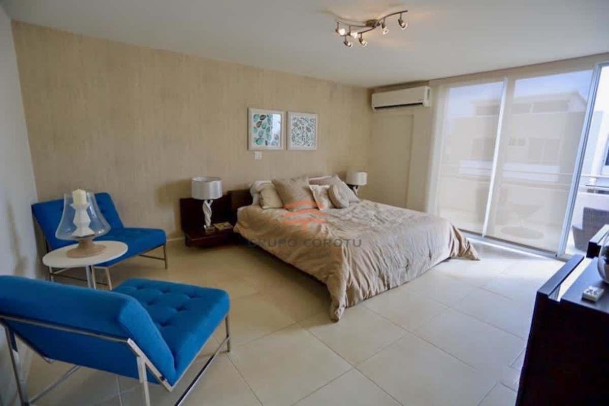 Bright modern bedroom with balcony entrance in duplex house Costa Sur Panama City
