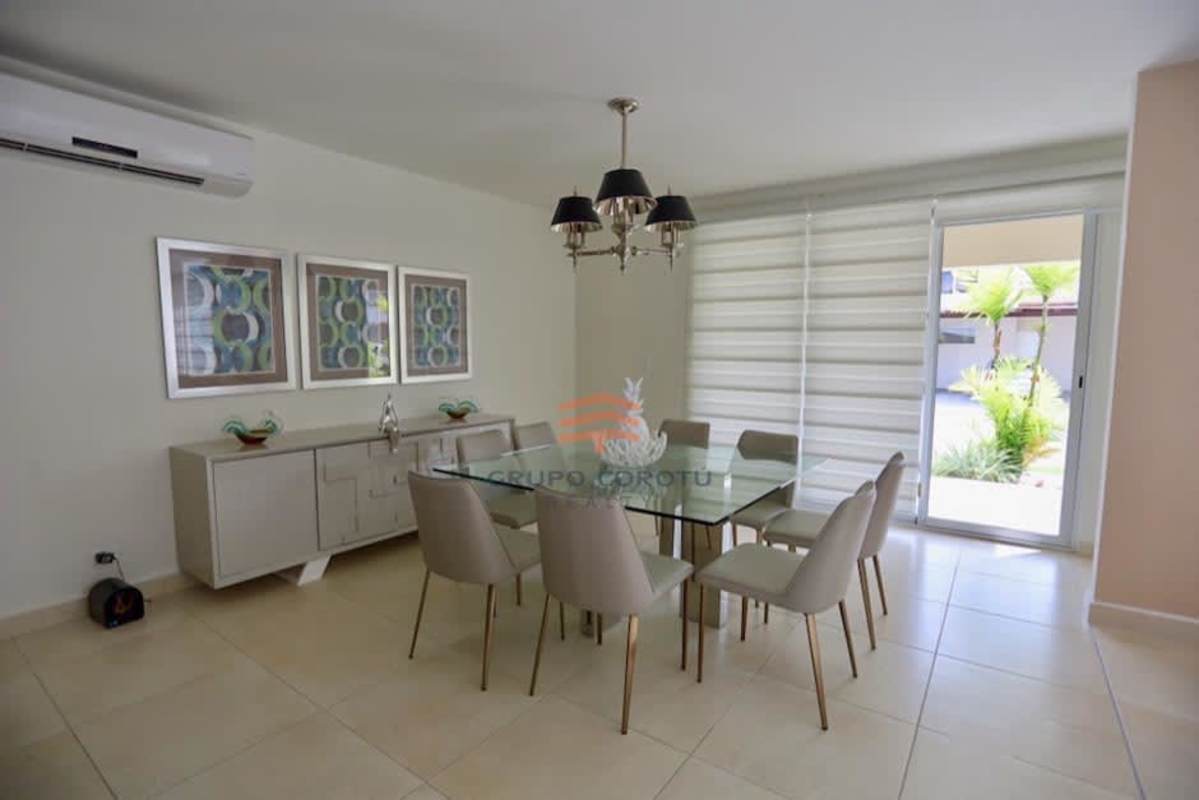Large dining room with access to outdoor terrace in Costa Sur duplex home