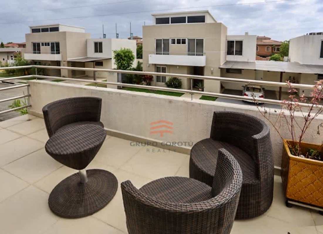 Balcony with outdoor seating overlooking gated community Costa Sur Panama