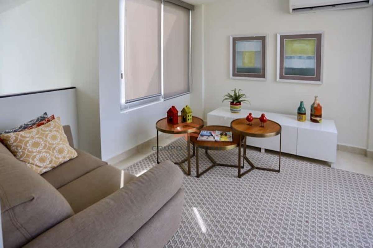 Modern minimalist living room with elegant furnishings in Costa Sur duplex Panama
