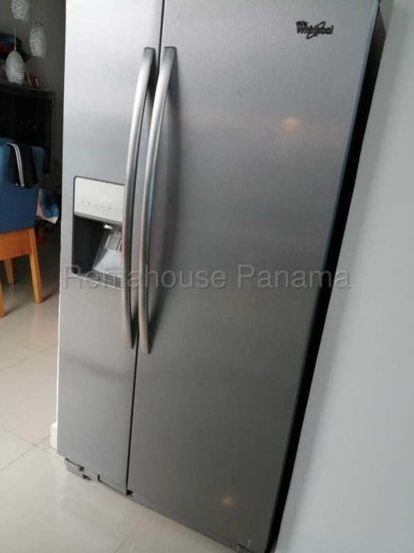 Spacious bedroom with large window, built-in wardrobe, split A/C PH Rainbow Tower Panama City