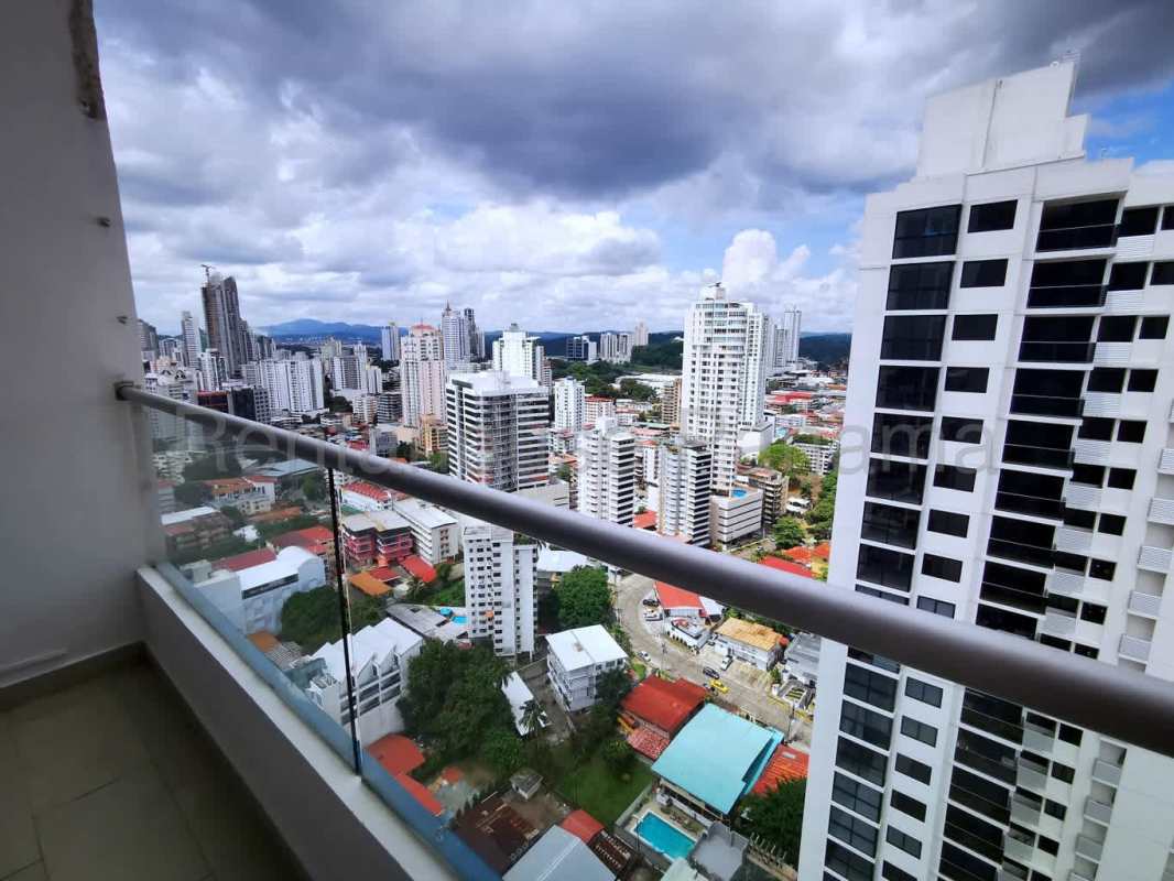 Balcony with glass railing panoramic skyline view PH Rainbow Tower Panama