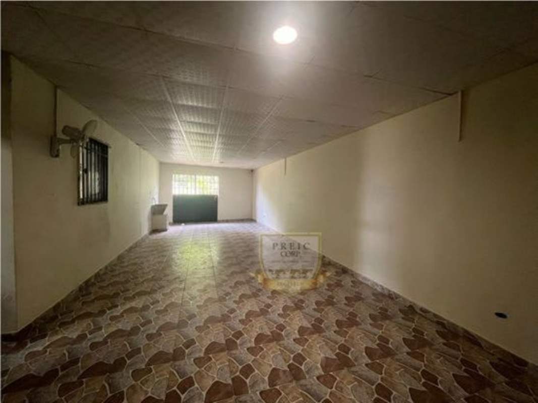 Traditional bathroom with basin sink, mirror, glass shower door in Tocumen house