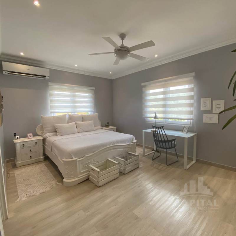 Bright bedroom with large windows, balcony access, AC, contemporary decor Rainforest Village