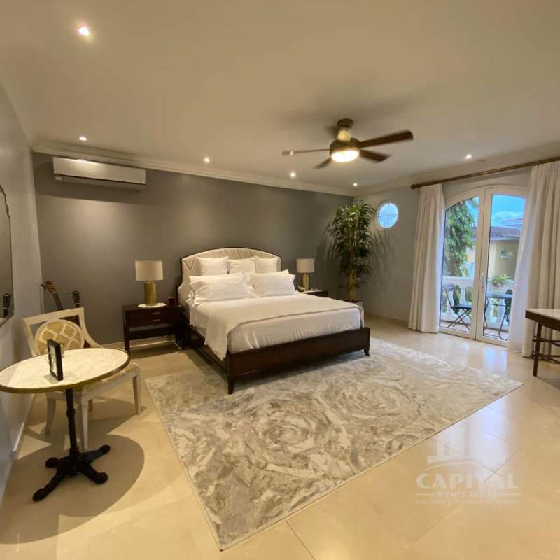 Covered patio with ceiling fans, garden view, Mediterranean design, outdoor living in Rainforest Village Panama