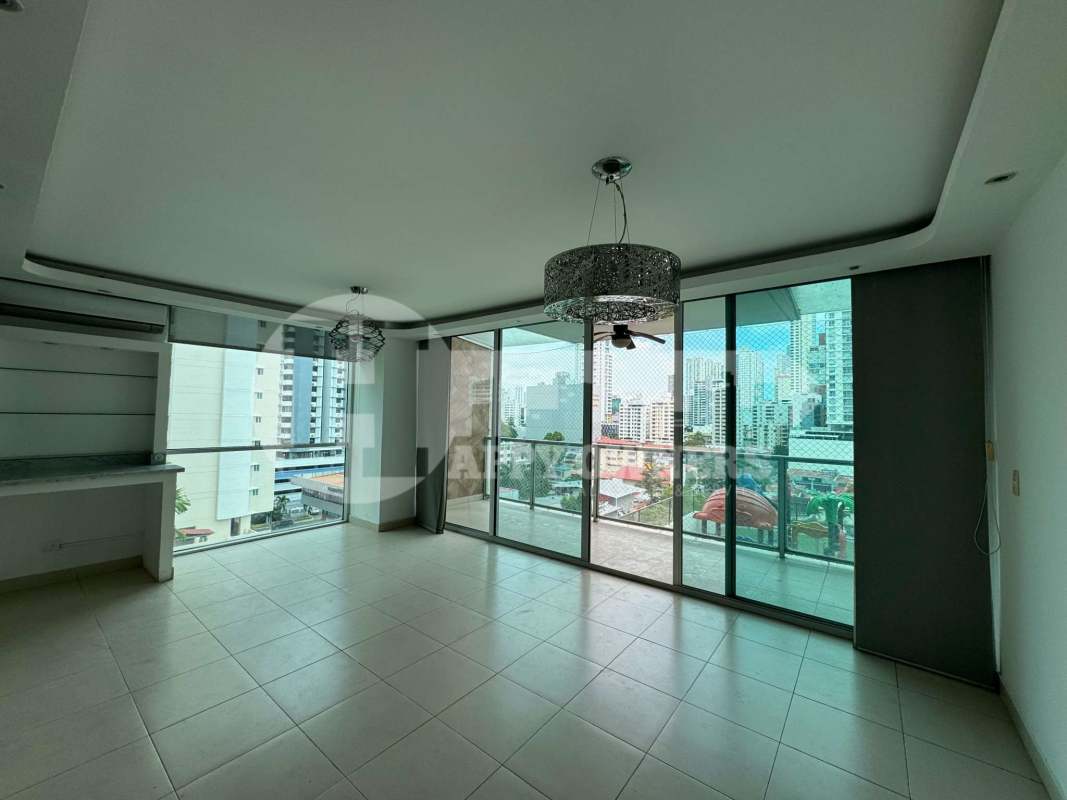 Spacious living room with floor-to-ceiling windows and balcony PH TAO San Francisco Panama