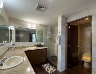 Swimming pool with loungers and garden at Vista Mar Golf Beach Marina Panama