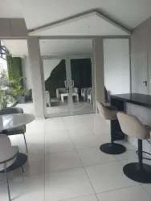 Bright empty commercial interior with white walls and tile floor for lease Via España Panama