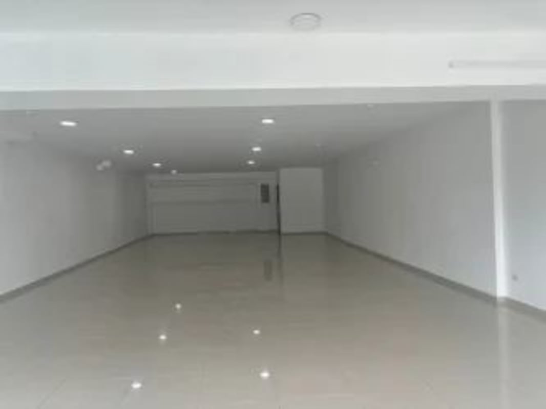 Large modern open commercial interior with tiled floors and lighting in Obarrio Panama
