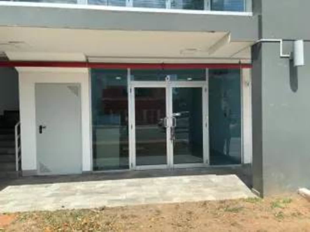 Front of commercial retail plaza with glass facade on Via España Panama City