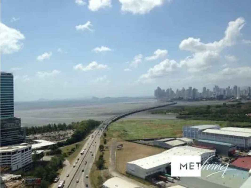 Large living room with bright windows, balcony access, Costa del Este ocean view