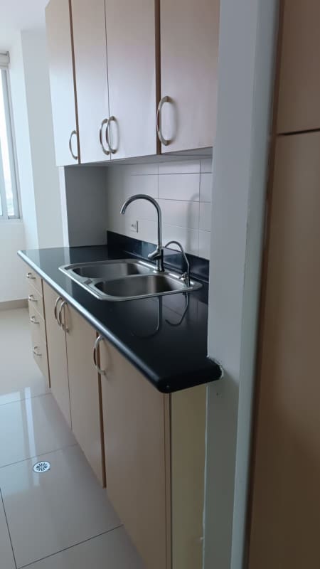 Modern kitchen with granite countertops, tile backsplash, stainless appliances Costa del Este