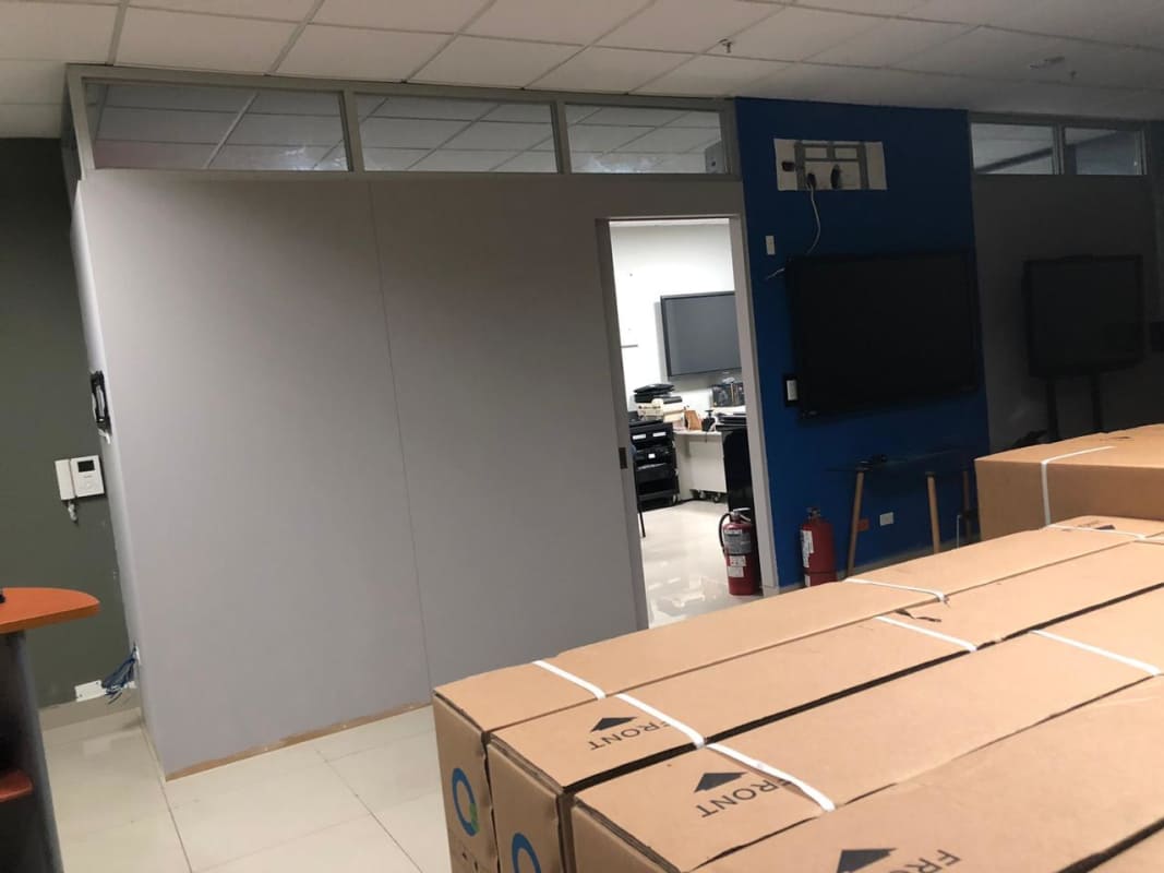 Office area with glass partitions and AC unit in PH Design Center Via Brasil Panama City