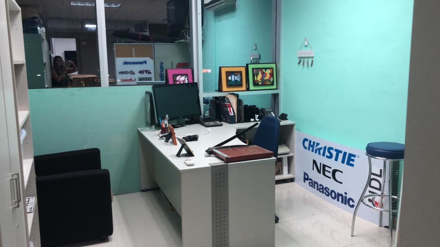 Glass desk with flat screen monitors in commercial office PH Design Center Via Brasil Panama