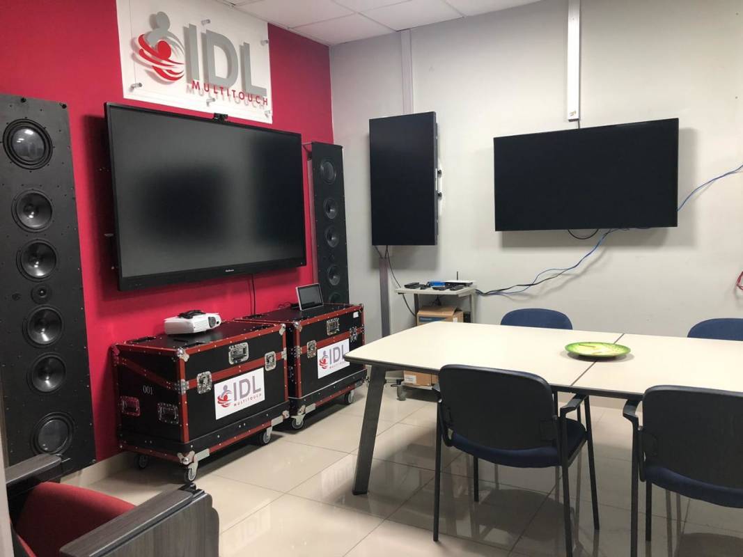 Spacious meeting or conference room in commercial office with blinds and projector wall near Via Brasil Panama