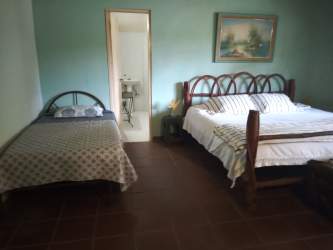 Bright living room with sofa, wooden table fully furnished beach rental Coronado Panama