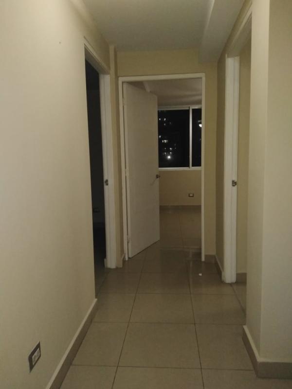 Bedroom with closet, large window and ceramic tile floors in PH Rokas Condado del Rey Panama City