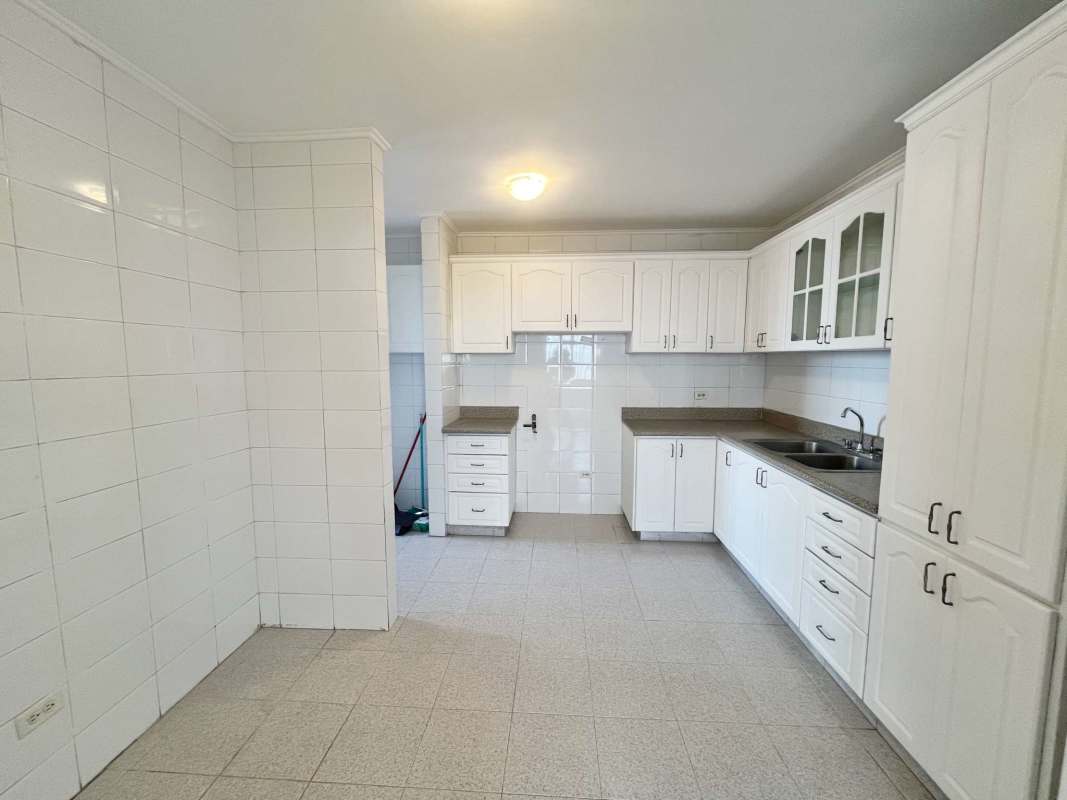 Bright bedroom with large window offering city view at PH Plaza Real San Francisco Panama