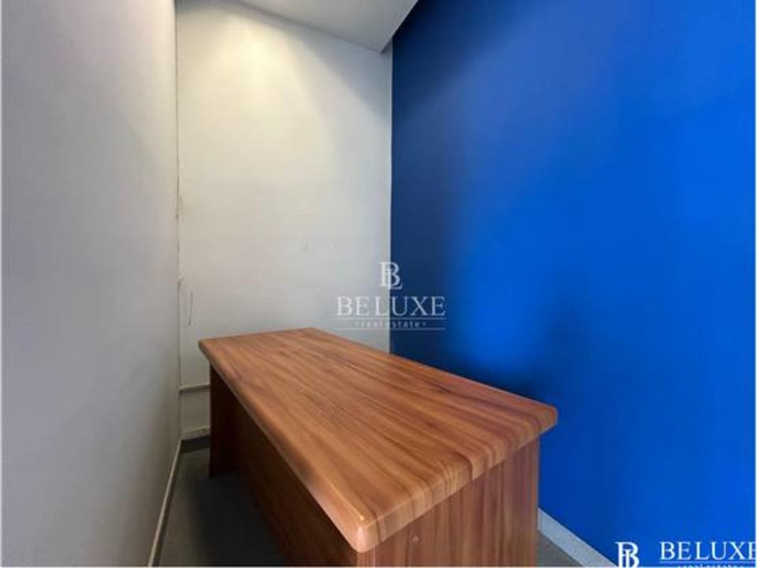 Modern private office with blue accent wall in San Francisco Commercial Plaza Panama