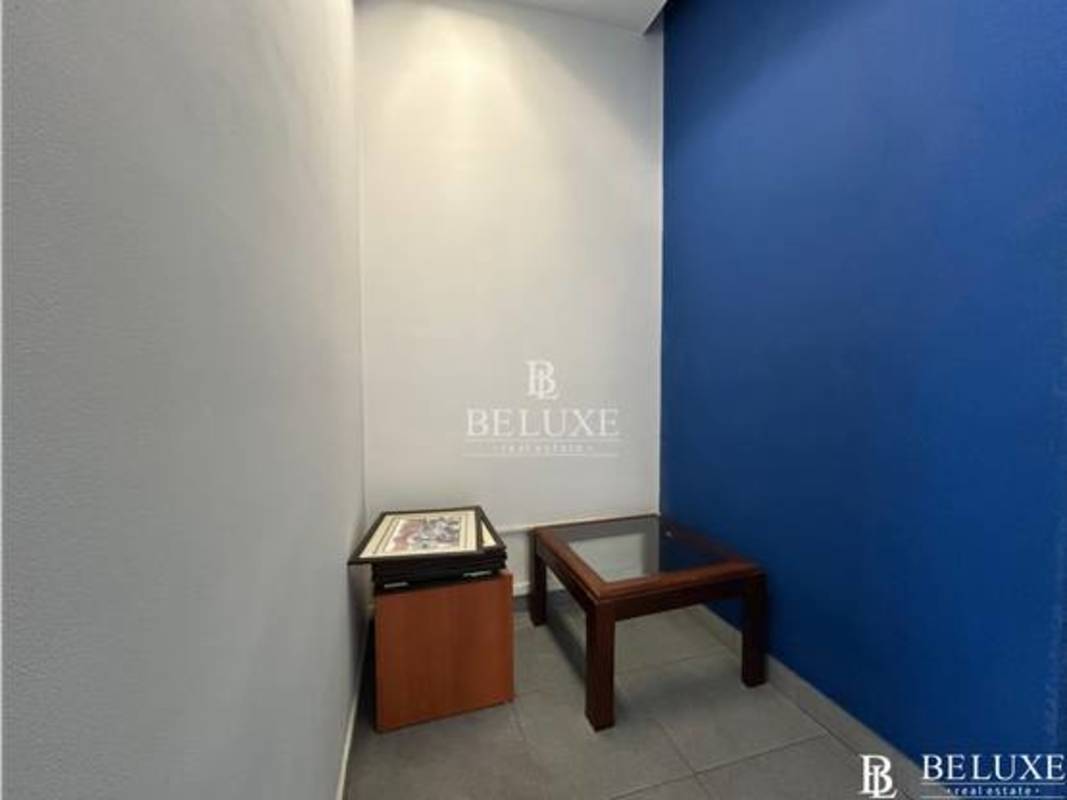 Bright office showroom with blue wall tile flooring in commercial San Francisco Plaza Panama