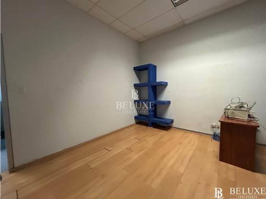 Office with glass partitions blue accent wall San Francisco Plaza Panama