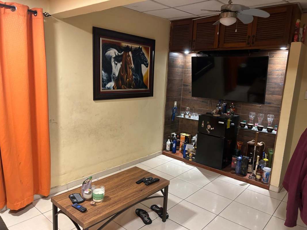 Entertainment living room wood panel bar mini fridge Cerro Viento San Antonio house Panama