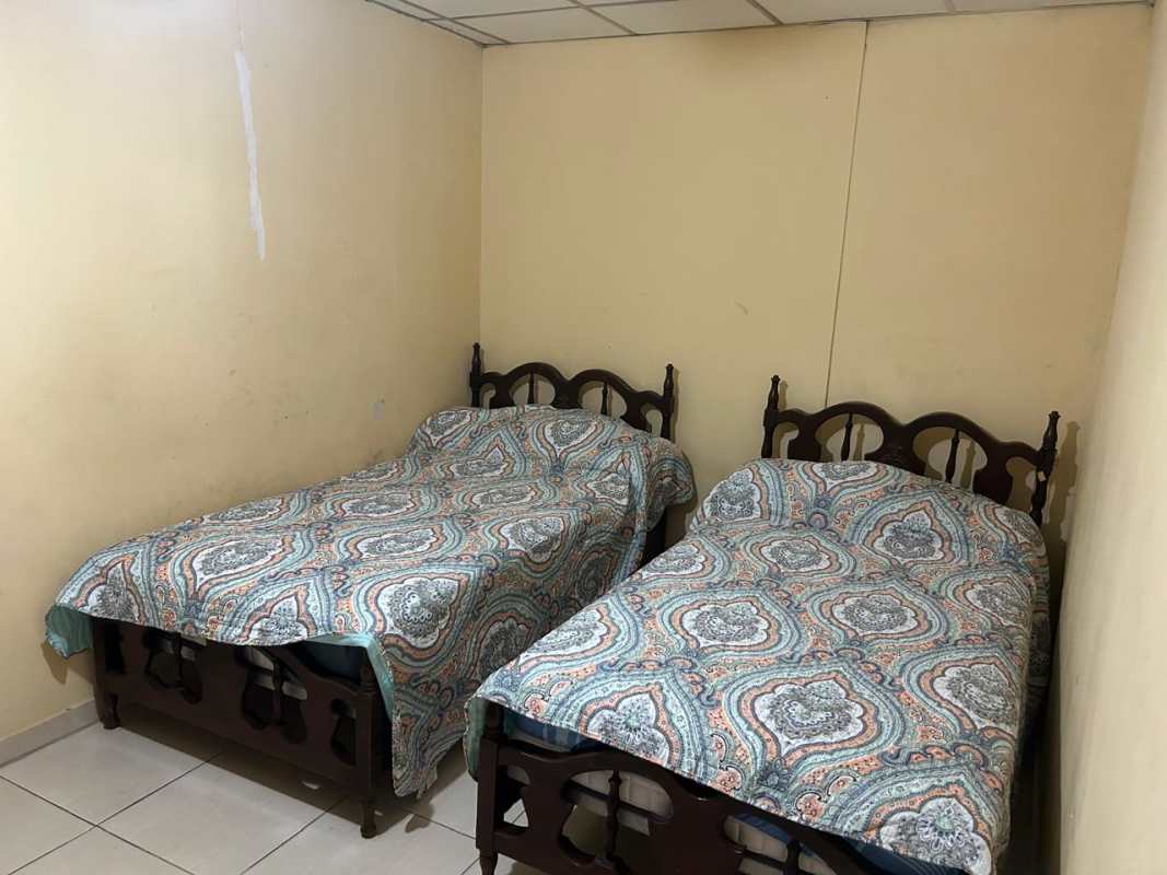 Modest bedroom twin beds patterned covers Cerro Viento San Antonio Panama house sale
