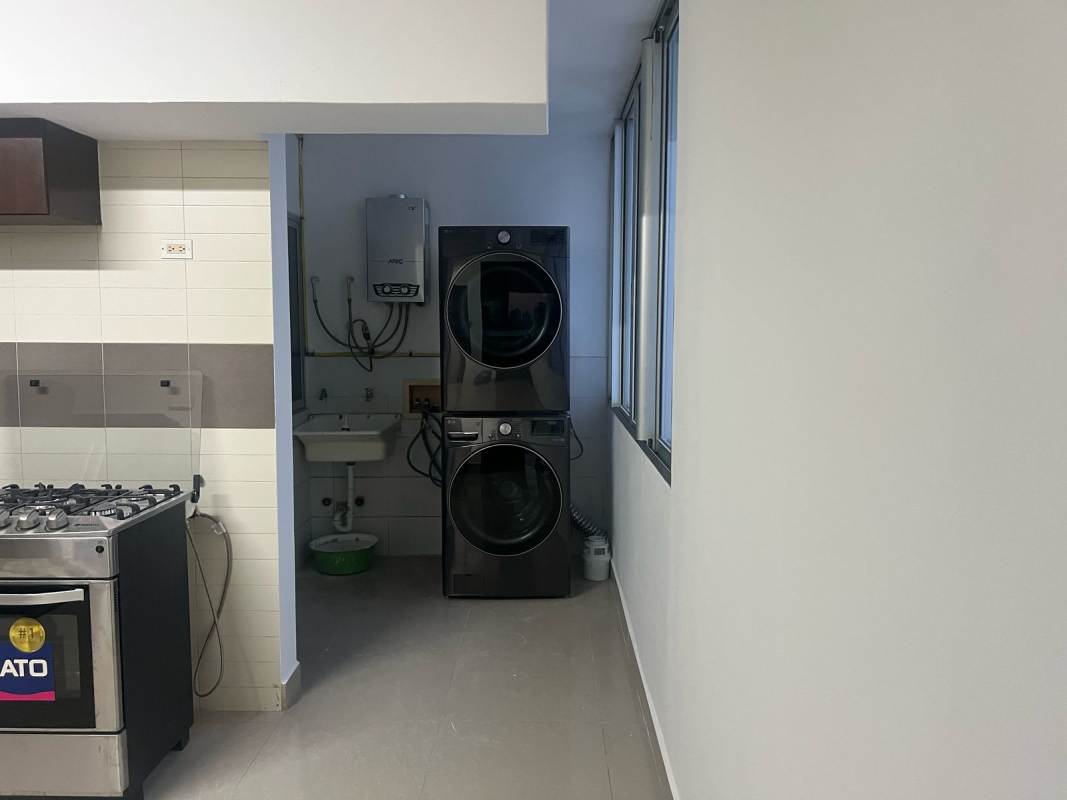 Laundry area adjacent to maid's room with washer, dryer Infinity Tower Panama City