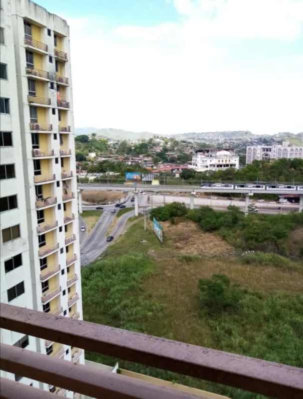 City skyline, green hills and residential buildings by Via Cincuentenario Panama City PH 4 Islas