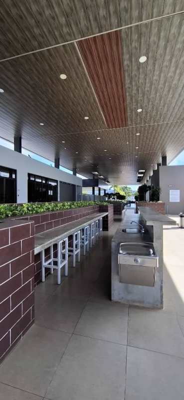 Kitchen with gas stove, range hood, cabinets and dining set PH Victoria Villa Zaita