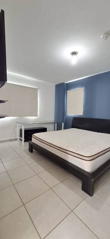 Bedroom with blue wall, bed, desk, window blinds, split AC PH Victoria Villa Zaita