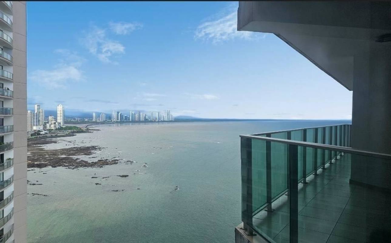 Modern kitchen with wood cabinets and granite countertops in oceanfront apartment Punta Pacifica