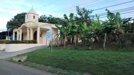 Mediterranean style building entrance with bell tower near Las Palmitas Las Tablas