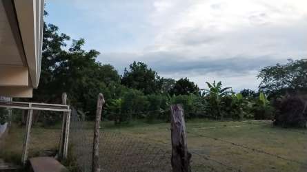 Asphalt road with greenery around Las Palmitas land plot for sale Los Santos Panama