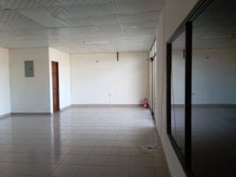 Bright empty commercial corner space tile floor drop ceiling Plaza Las Palmas La Chorrera
