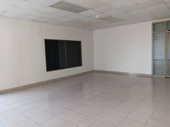 Commercial store tile floor drop ceiling fluorescent lights at Plaza Las Palmas