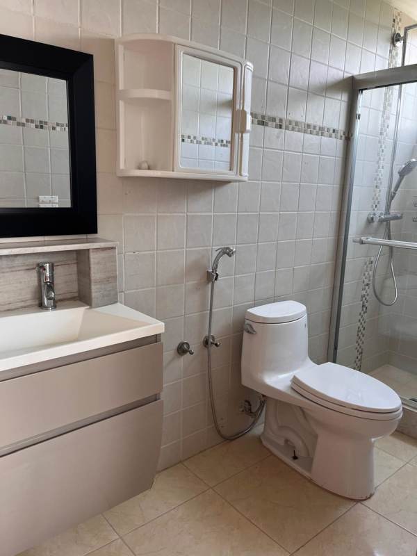 Bathroom with glass walk-in shower, vanity sink, bidet sprayer in PH Pine Hill luxury apartment Panama