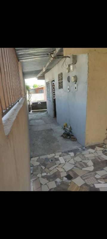 Fenced walkway with mosaic tiles near independent entry apartment for rent