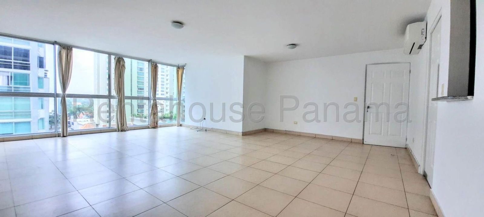 Modern kitchen with granite countertops, black appliances in apartment for sale Costa del Este Panama